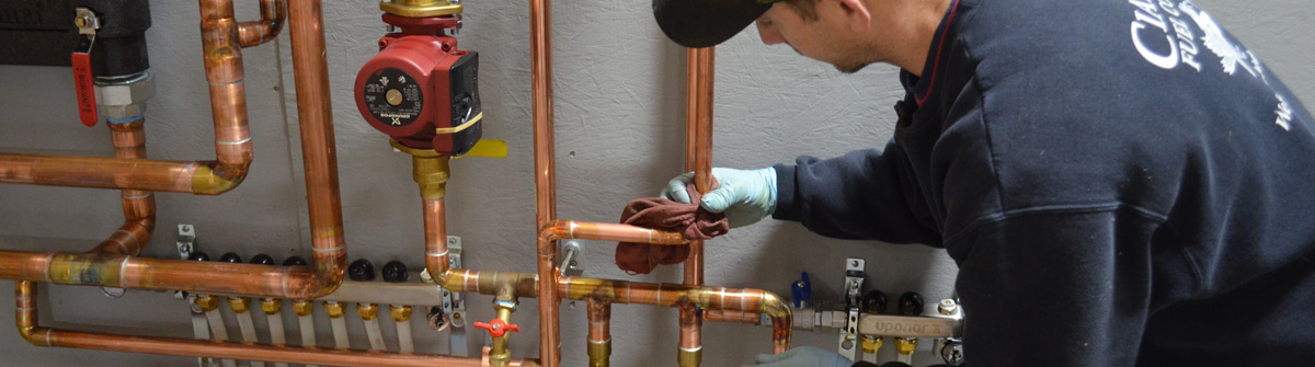 Ciardelli Fuel technician performing annual HVAC system maintenance